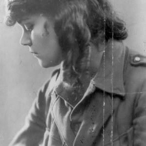 Young woman in vintage military uniform.